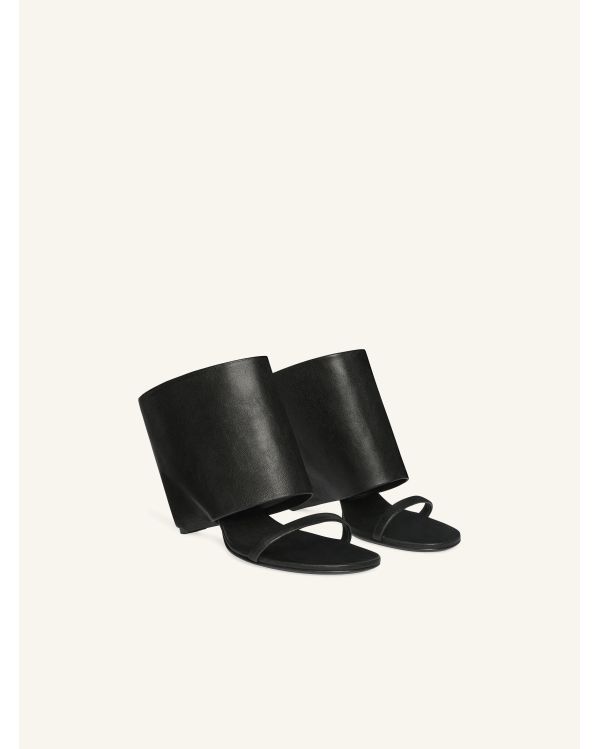 MULES COMPENSEES OBLIQUES EN CUIR NOIR