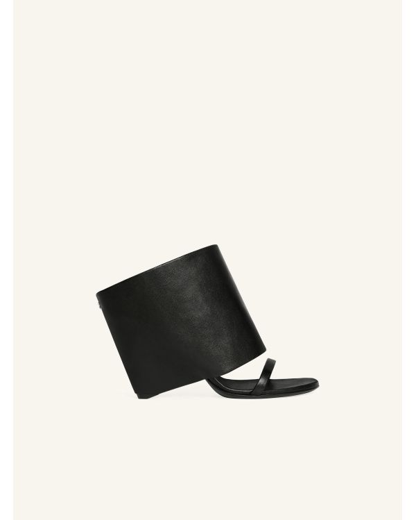 MULES COMPENSEES OBLIQUES EN CUIR NOIR
