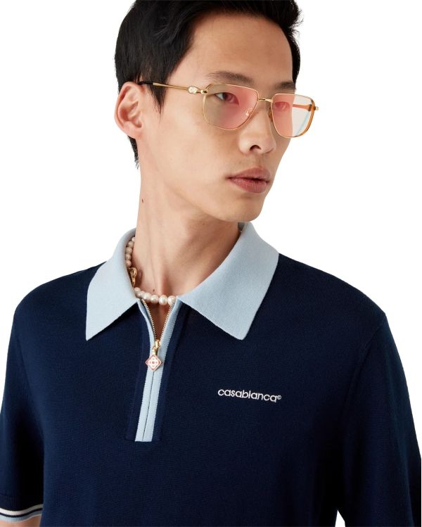 POLO DE TENNIS EN TRICOT MÉRINOS MARINE